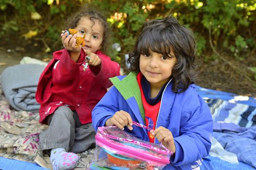 October 4, 2015; Bapska in Serbia. Group of refugees leaving Serbia. They came to Bapska by buses and then they leaving Serbia and go to Croatia and then to Germany. Many of them escapes from home because of civil war. 