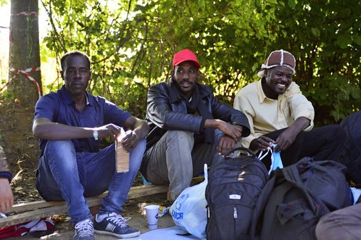 October 4, 2015; Bapska in Serbia. Group of refugees leaving Serbia. They came to Bapska by buses and then they leaving Serbia and go to Croatia and then to Germany. Many of them escapes from home because of civil war. 