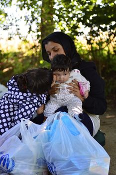 October 4, 2015; Bapska in Serbia. Group of refugees leaving Serbia. They came to Bapska by buses and then they leaving Serbia and go to Croatia and then to Germany. Many of them escapes from home because of civil war. 