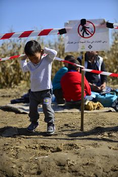 October 4, 2015; Bapska in Serbia. Group of refugees leaving Serbia. They came to Bapska by buses and then they leaving Serbia and go to Croatia and then to Germany. Many of them escapes from home because of civil war. 