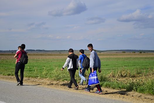 October 4, 2015; Sid in Serbia. Group of Afghan refugees leaving Serbia. They came to Sid by taxi and then they leaving Serbia and go to Croatia and then to Germany. Many of them escapes from home because of civil war. 