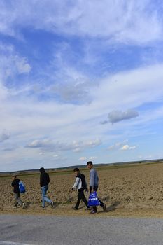 October 4, 2015; Sid in Serbia. Group of Afghan refugees leaving Serbia. They came to Sid by taxi and then they leaving Serbia and go to Croatia and then to Germany. Many of them escapes from home because of civil war. 