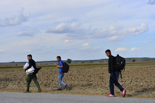 October 4, 2015; Sid in Serbia. Group of Afghan refugees leaving Serbia. They came to Sid by taxi and then they leaving Serbia and go to Croatia and then to Germany. Many of them escapes from home because of civil war. 