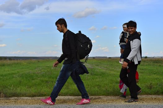 October 4, 2015; Sid in Serbia. Group of Afghan refugees leaving Serbia. They came to Sid by taxi and then they leaving Serbia and go to Croatia and then to Germany. Many of them escapes from home because of civil war. 