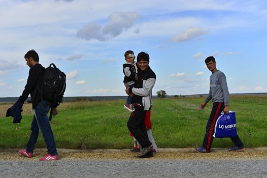 October 4, 2015; Sid in Serbia. Group of Afghan refugees leaving Serbia. They came to Sid by taxi and then they leaving Serbia and go to Croatia and then to Germany. Many of them escapes from home because of civil war. 