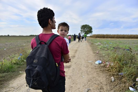 October 4, 2015; Sid in Serbia. Group of Afghan refugees leaving Serbia. They came to Sid by taxi and then they leaving Serbia and go to Croatia and then to Germany. Many of them escapes from home because of civil war. 