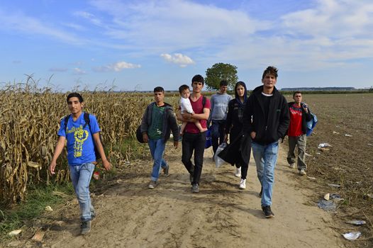 October 4, 2015; Sid in Serbia. Group of Afghan refugees leaving Serbia. They came to Sid by taxi and then they leaving Serbia and go to Croatia and then to Germany. Many of them escapes from home because of civil war. 