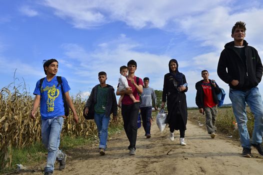 October 4, 2015; Sid in Serbia. Group of Afghan refugees leaving Serbia. They came to Sid by taxi and then they leaving Serbia and go to Croatia and then to Germany. Many of them escapes from home because of civil war. 