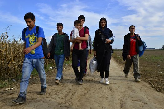 October 4, 2015; Sid in Serbia. Group of Afghan refugees leaving Serbia. They came to Sid by taxi and then they leaving Serbia and go to Croatia and then to Germany. Many of them escapes from home because of civil war. 