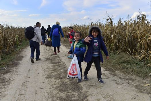 October 4, 2015; Sid in Serbia. Group of Afghan refugees leaving Serbia. They came to Sid by taxi and then they leaving Serbia and go to Croatia and then to Germany. Many of them escapes from home because of civil war. 
