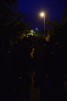 October 4, 2015; Bapska in Serbia. Group of refugees leaving Serbia. They came to Bapska by buses and then they leaving Serbia and go to Croatia and then to Germany. Many of them escapes from home because of civil war. 
