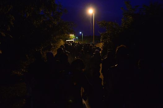 October 4, 2015; Bapska in Serbia. Group of refugees leaving Serbia. They came to Bapska by buses and then they leaving Serbia and go to Croatia and then to Germany. Many of them escapes from home because of civil war. 