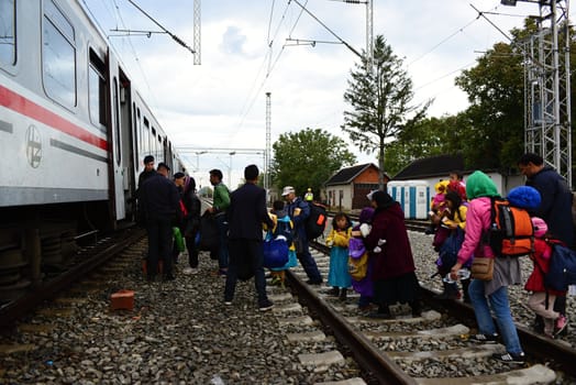 October 6,2015; Hegyeshalom in Hungary. Group of refugees leaving Hungary. They came to Hegyeshalom by train and then they leaving Hungary and go to Austria and then to Germany. Many of them escapes from home because of civil war. 
