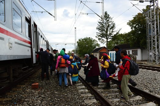 October 6,2015; Hegyeshalom in Hungary. Group of refugees leaving Hungary. They came to Hegyeshalom by train and then they leaving Hungary and go to Austria and then to Germany. Many of them escapes from home because of civil war. 