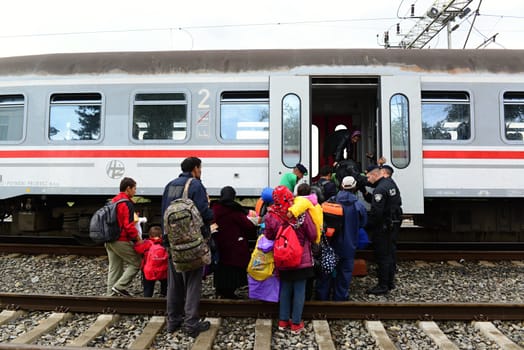 October 6,2015; Hegyeshalom in Hungary. Group of refugees leaving Hungary. They came to Hegyeshalom by train and then they leaving Hungary and go to Austria and then to Germany. Many of them escapes from home because of civil war. 