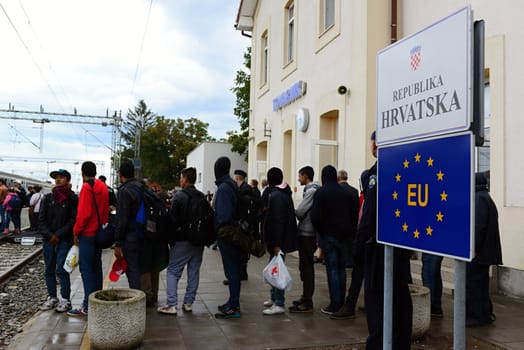 October 6,2015; Hegyeshalom in Hungary. Group of refugees leaving Hungary. They came to Hegyeshalom by train and then they leaving Hungary and go to Austria and then to Germany. Many of them escapes from home because of civil war. 