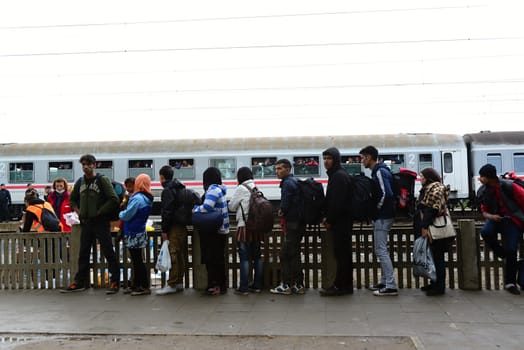 October 6,2015; Hegyeshalom in Hungary. Group of refugees leaving Hungary. They came to Hegyeshalom by train and then they leaving Hungary and go to Austria and then to Germany. Many of them escapes from home because of civil war. 