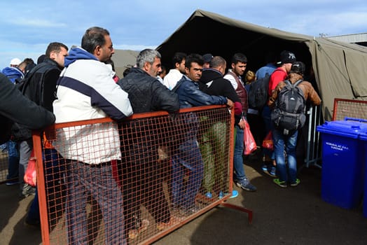October 6,2015; Hegyeshalom in Hungary. Group of refugees leaving Hungary. They came to Hegyeshalom by train and then they leaving Hungary and go to Austria and then to Germany. Many of them escapes from home because of civil war. 