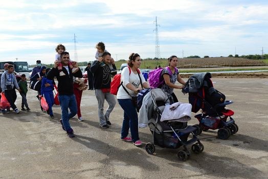 October 6,2015; Hegyeshalom in Hungary. Group of refugees leaving Hungary. They came to Hegyeshalom by train and then they leaving Hungary and go to Austria and then to Germany. Many of them escapes from home because of civil war. 