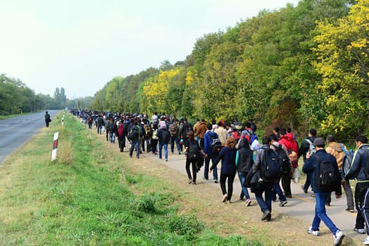 October 6,2015; Hegyeshalom in Hungary. Group of refugees leaving Hungary. They came to Hegyeshalom by train and then they leaving Hungary and go to Austria and then to Germany. Many of them escapes from home because of civil war. 