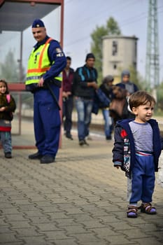 October 6,2015; Hegyeshalom in Hungary. Group of refugees leaving Hungary. They came to Hegyeshalom by train and then they leaving Hungary and go to Austria and then to Germany. Many of them escapes from home because of civil war. 
