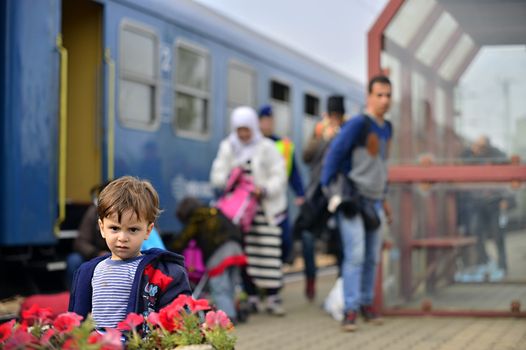 October 6,2015; Hegyeshalom in Hungary. Group of refugees leaving Hungary. They came to Hegyeshalom by train and then they leaving Hungary and go to Austria and then to Germany. Many of them escapes from home because of civil war. 