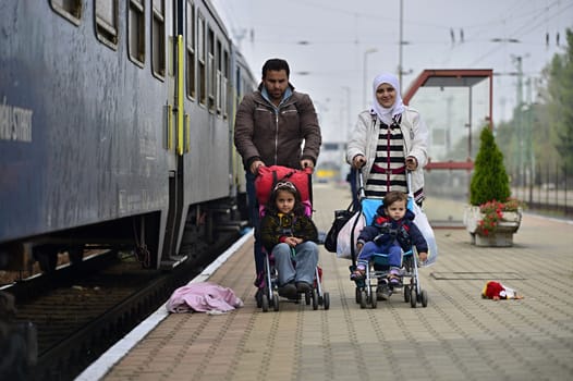 October 6,2015; Hegyeshalom in Hungary. Group of refugees leaving Hungary. They came to Hegyeshalom by train and then they leaving Hungary and go to Austria and then to Germany. Many of them escapes from home because of civil war. 