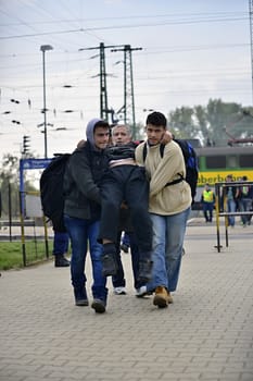 October 6,2015; Hegyeshalom in Hungary. Group of refugees leaving Hungary. They came to Hegyeshalom by train and then they leaving Hungary and go to Austria and then to Germany. Many of them escapes from home because of civil war. 