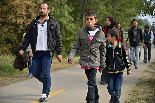 October 6,2015; Hegyeshalom in Hungary. Group of refugees leaving Hungary. They came to Hegyeshalom by train and then they leaving Hungary and go to Austria and then to Germany. Many of them escapes from home because of civil war. 