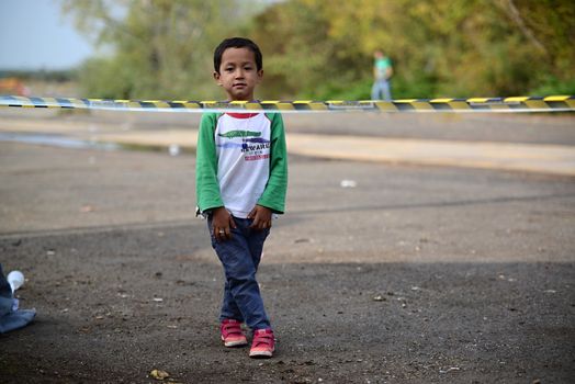 October 6,2015; Hegyeshalom in Hungary. Group of refugees leaving Hungary. They came to Hegyeshalom by train and then they leaving Hungary and go to Austria and then to Germany. Many of them escapes from home because of civil war. 