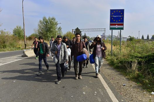 October 6,2015; Hegyeshalom in Hungary. Group of refugees leaving Hungary. They came to Hegyeshalom by train and then they leaving Hungary and go to Austria and then to Germany. Many of them escapes from home because of civil war. 