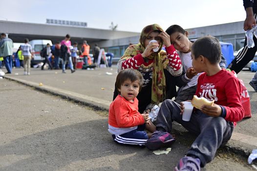 October 6,2015; Hegyeshalom in Hungary. Group of refugees leaving Hungary. They came to Hegyeshalom by train and then they leaving Hungary and go to Austria and then to Germany. Many of them escapes from home because of civil war. 