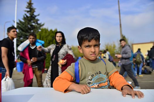 October 6,2015; Hegyeshalom in Hungary. Group of refugees leaving Hungary. They came to Hegyeshalom by train and then they leaving Hungary and go to Austria and then to Germany. Many of them escapes from home because of civil war. 