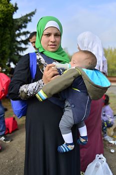 October 6,2015; Hegyeshalom in Hungary. Group of refugees leaving Hungary. They came to Hegyeshalom by train and then they leaving Hungary and go to Austria and then to Germany. Many of them escapes from home because of civil war. 