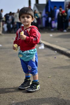October 6,2015; Hegyeshalom in Hungary. Group of refugees leaving Hungary. They came to Hegyeshalom by train and then they leaving Hungary and go to Austria and then to Germany. Many of them escapes from home because of civil war. 