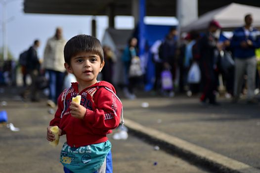 October 6,2015; Hegyeshalom in Hungary. Group of refugees leaving Hungary. They came to Hegyeshalom by train and then they leaving Hungary and go to Austria and then to Germany. Many of them escapes from home because of civil war. 