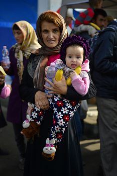 October 6,2015; Hegyeshalom in Hungary. Group of refugees leaving Hungary. They came to Hegyeshalom by train and then they leaving Hungary and go to Austria and then to Germany. Many of them escapes from home because of civil war. 