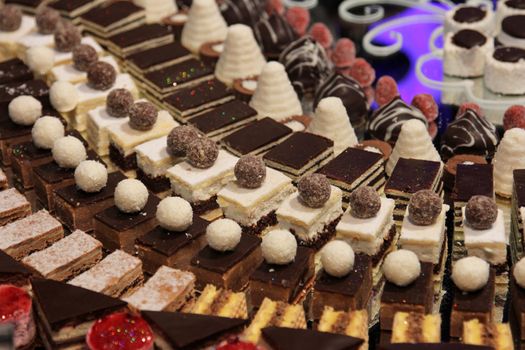 Colorful desserts and pastry served on a wedding party