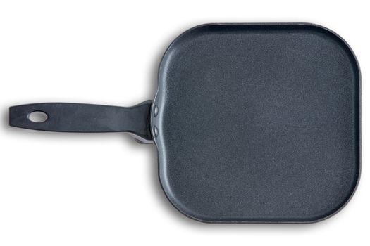 Overhead view of a clean lightly used square kitchen skillet with chamfered corners on a white background