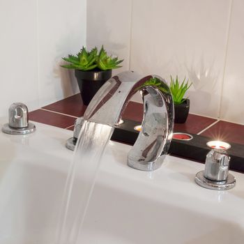 bath with water candles and plants