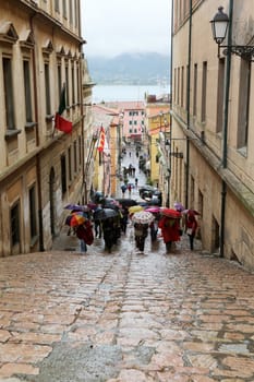 Tourists walking up stairs in street on May 03, 2014 Portoferraio, Italy