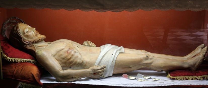 Statue of Jesus Christ in the tomb in the Church of the Holy Sacrament in Portoferraio, Elba, Italy on May 03, 2014 Portoferraio, Italy