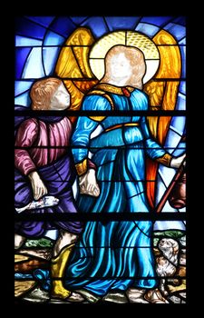 Angel guardian stained glass window in the Church of the Holy Sacrament in Portoferraio, Elba, Italy on May 03, 2014 Portoferraio, Italy