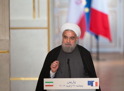 FRANCE, Paris : Iranian President Hassan Rouhani give a joint press conference with the French President on January 28, 2016 at the Elysee presidential Palace in Paris.President Hassan Rouhani hailed a new relationship between Iran and France during a visit that saw the signing of a host of post-sanctions business deals. 