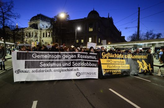AUSTRIA, Vienna: Demonstrators march against the annual Academic Ball in Vienna, Austria on January 29, 2016.The protesters held banners in favor of immigration and against the far-right Freedom Party of Austria, which organized the ball.