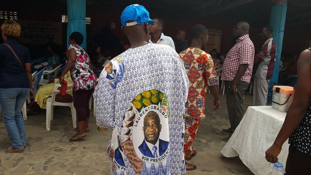 IVORY COAST, Abidjan : Supporters of former Ivorian president Laurent Gbagbo gestures after attending a live broadcast of his trial in front of the International Criminal Court (ICC) in The Hague, on January 29, 2016 in Yopougon district,  his former fiefdom in Abidjan.The high-profile trial of former Ivorian president Laurent Gbagbo opened today five years after post-election violence wracked his nation, with supporters and foes aiming to shed light on the turmoil that left 3,000 dead.