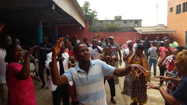 IVORY COAST, Abidjan : Supporters of former Ivorian president Laurent Gbagbo gestures after attending a live broadcast of his trial in front of the International Criminal Court (ICC) in The Hague, on January 29, 2016 in Yopougon district,  his former fiefdom in Abidjan.The high-profile trial of former Ivorian president Laurent Gbagbo opened today five years after post-election violence wracked his nation, with supporters and foes aiming to shed light on the turmoil that left 3,000 dead.