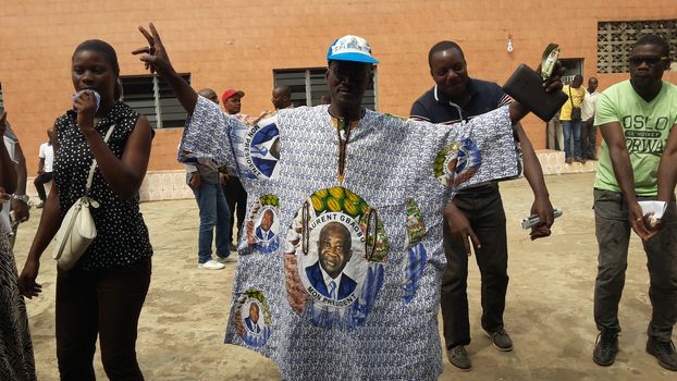 IVORY COAST, Abidjan : Supporters of former Ivorian president Laurent Gbagbo gestures after attending a live broadcast of his trial in front of the International Criminal Court (ICC) in The Hague, on January 29, 2016 in Yopougon district,  his former fiefdom in Abidjan.The high-profile trial of former Ivorian president Laurent Gbagbo opened today five years after post-election violence wracked his nation, with supporters and foes aiming to shed light on the turmoil that left 3,000 dead.