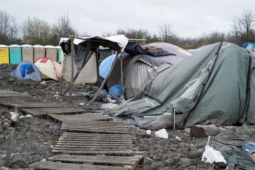 FRANCE, Grande-Synthe: Tents are seen in the mud in the camp in Grande-Synthe, northern France on January 29, 2016.