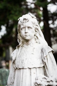 More than 100 years old statue. Cemetery located in North Italy.